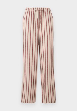 Φόρμες ανοιχτού μπεζ χρώματος με κάθετες κόκκινες ρίγες, ελαστική μέση και κορδόνι, σε ίσια γραμμή.