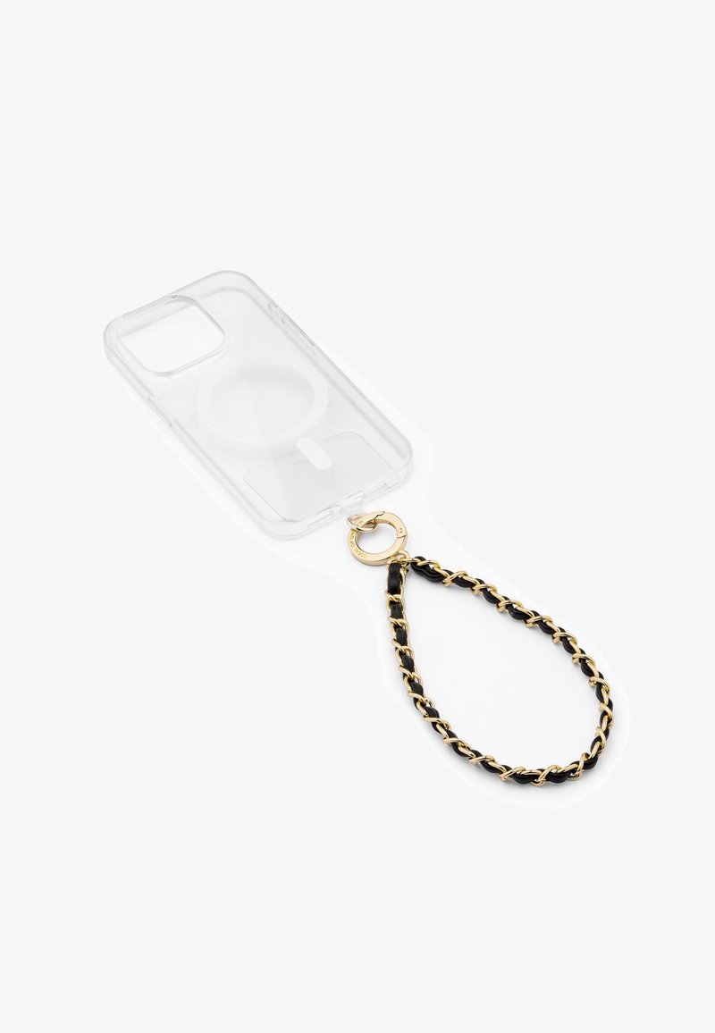 Transparante telefoonhoes met gouden hardware en een kettingriem in zwart met gouden accenten. Cirkelvormige uitsparing voor magnetische bevestiging.