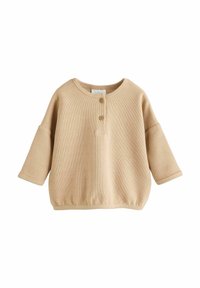 Beige Henley-Oberteil mit rundem Ausschnitt, drei Holzknöpfen und locker sitzenden Ärmeln. Hergestellt aus strukturiertem Baumwollstoff.