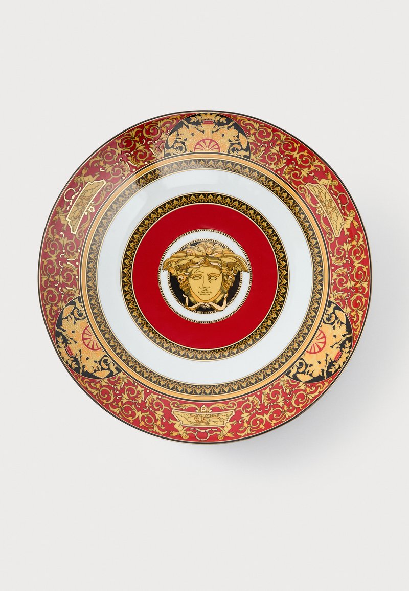Red and gold decorative plate featuring a central Medusa motif, intricate floral patterns, and a smooth, glossy finish.