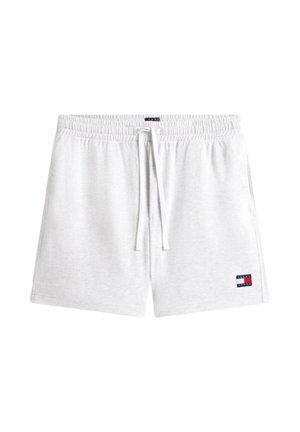 Pantalones cortos blancos con cintura elástica, cordón ajustable y pequeño parche con el logo de Tommy Jeans en la parte inferior izquierda de la pierna.