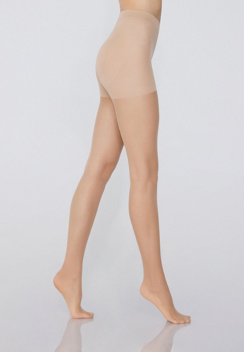 Hladké tělové bezešvé tvarující šortky s vysokým pasem, jemnou strukturou a průhledným povrchem, navržené pro štíhlou siluetu.