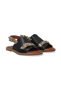 Schwarze Leder-Sandalen mit offenen Zehen, ausgestattet mit Leo-Print-Riemen und Metall-Schnallen. Flache Sohle mit einem hellbraunen Rand.