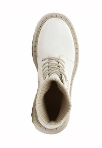White high-top boots made of smooth synthetic material. Features a ribbed beige knit collar and round toe, with light-colored laces.