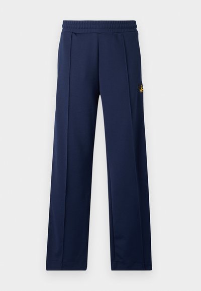 Marineblaue Sporthose mit glatter Textur, elastischem Bund und kleinem gesticktem Logo am oberen linken Bein. Klassisches Design mit geradem Bein.
