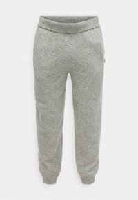 Γκρι φόρμες από μαλακό, υφασμάτινο υλικό. Διαθέτουν ελαστική μέση και στενά μπατζάκια. Απλός, χωρίς στολίδια σχεδιασμός.