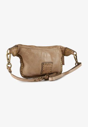Tan leather crossbody bag with brass studs along edges and a central logo patch, featuring an adjustable strap with clasp closures.