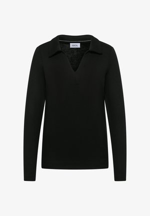 Polo negro de manga larga con escote en V y cuello. Fabricado con un tejido texturizado, que presenta un sutil patrón de punto y un ajuste relajado.