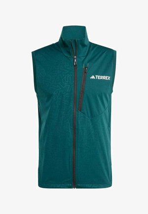 Green sleeveless vest made of soft fabric featuring a geometric pattern, a high collar, a front zipper, and a chest pocket with zipper.