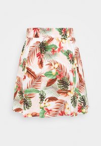 Jupe blanche avec ceinture élastique présentant un imprimé tropical de feuilles et de fleurs vertes, brunes et rouges, design légèrement évasé.
