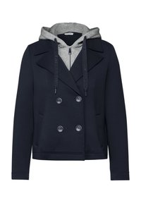 Blazer bleu marine à double boutonnage avec un sweat à capuche gris zippé porté en dessous, doté de cordons de serrage et de poches avant.
