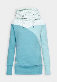 Sweat à capuche manches longues avec bloc de couleurs bleu clair et blanc, capuche à motif zigzag, poches avant et cordons blancs avec embouts métalliques.