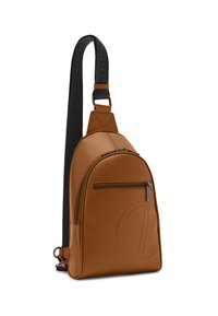 Brown leather sling backpack with a rounded shape, front zip pocket, embossed logo detail, and a black adjustable strap.