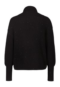 Suéter negro de punto con perfiles acanalados, de mangas largas y cuello alto, con pequeñas motas blancas dispersas por toda la prenda.
