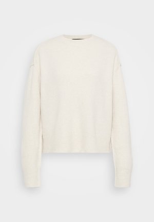White knit sweater with a crew neck and relaxed silhouette. Features ribbed cuffs and hem, made from a soft textured material.