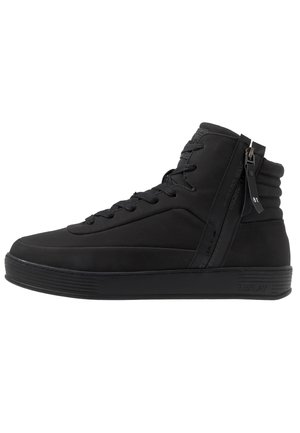 Black high-top sneaker with laces, padded ankle, side zipper, and textured sole, designed for casual wear.
