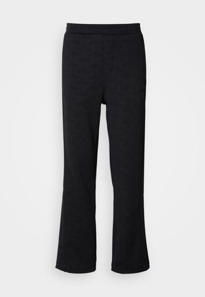Pantaloni neri a palazzo con un motivo geometrico testurizzato, vita elasticizzata e tasche laterali, realizzati in un materiale morbido e leggero.