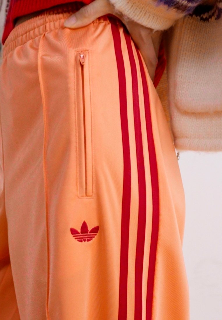 adidas Originals FIREBIRD - Pantaloni de trening - semi coral/team