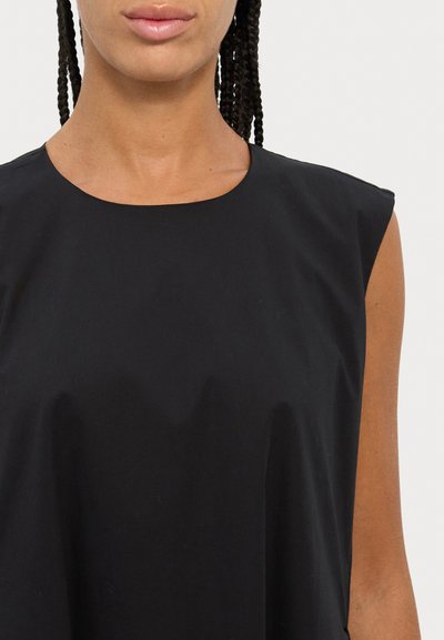 Black sleeveless top with a round neckline. Made of smooth fabric, it features minimalistic design and a loose fit. No visible patterns or accents.