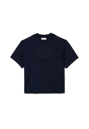 Marineblaues Baumwoll-T-Shirt mit einem strukturierten "TENNIS"-Logo-Patch und rundem Halsausschnitt. Kurze Ärmel und ein entspannter Schnitt.