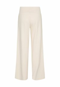 Cremfarbene, weit geschnittene Hosen aus einem weichen Material mit elastischem Bund. Sie haben ein schlichtes Design ohne sichtbare Verschlüsse oder Taschen.
