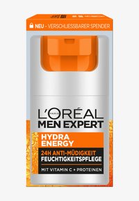 L'Oréal Men Expert Hydra Energy moisturizer in a white and orange container with a pump dispenser, featuring a glossy finish and bold black text.