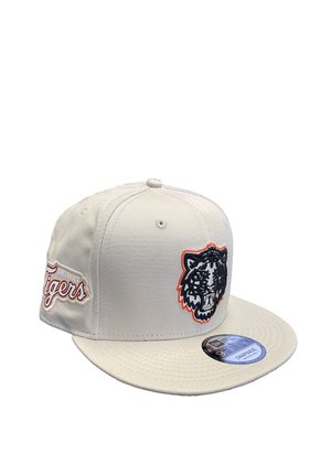 White baseball cap featuring a black tiger logo and orange accents, with a flat brim and textured fabric. Has a logo sticker on the brim.
