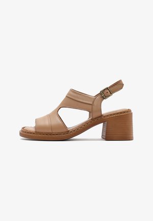 Tan leather open-toe sandal with cut-out sides, adjustable ankle strap with buckle, and a stacked block heel.