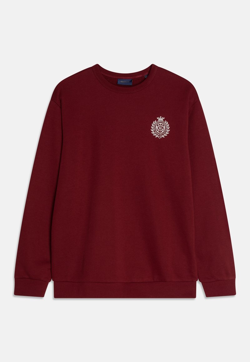 Sweatshirt bordeaux en tissu doux, avec un col rond, des manches longues et un petit logo blanc sur la poitrine.