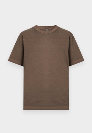 T-shirt marron en coton à manches courtes avec col rond, coutures visibles et étiquette de la marque GAP à l'intérieur du col.