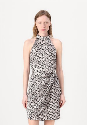 Floral halter-neck dress in black with white and pink daisies. Features a fitted silhouette and a knotted detail at the waist.