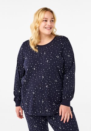 Navy pajama set featuring long sleeves with white star and moon print. Made from soft fabric, with a round neckline and fitted cuffs.