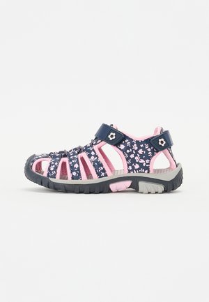 Navy and pink sandals with floral patterns, open design, adjustable strap, rubber sole, and multiple cutouts for breathability.