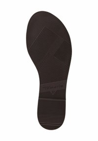 Barna gumibelső, amely texturált felülettel rendelkezik, lineáris és geometrikus mintákkal. Rajta a "Tamaris" felirat és a "37" méret.