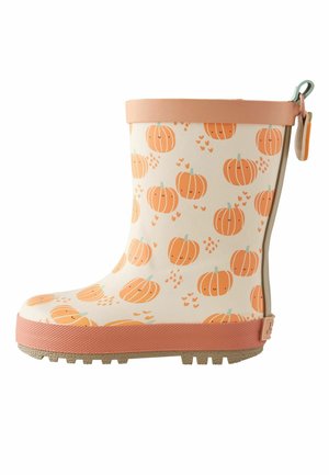 Child's beige rain boot with orange pumpkin patterns, peach-colored sole and trim, and a pull tab at the back.