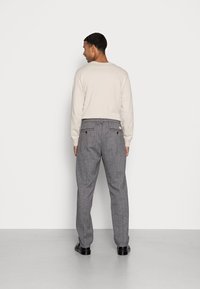 Levi's® XX CHINO EZ TAPER II - Calças - liquorice herringbone black