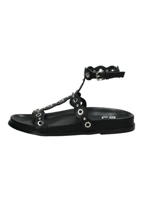 Sandalo nero basso con cinturino alla caviglia, decorato con occhielli argentati e bordi smerlati sulle fascette, vista laterale su sfondo bianco.