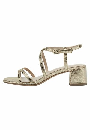 Gold metallic snakeskin-patterned strappy sandal with ankle buckle and low block heel, side view on white background.