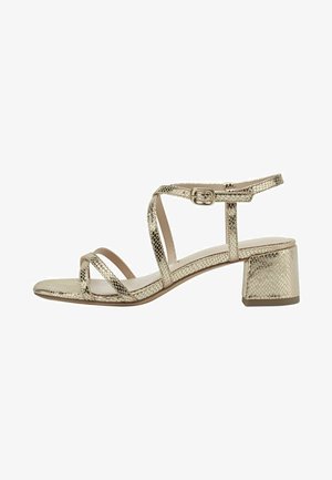 Gold metallic snakeskin-patterned strappy sandal with ankle buckle and low block heel, side view on white background.