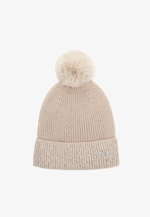 Beige gebreide muts met een grote nepbont pompon bovenop, voorzien van een geribbelde manchet versierd met kleine, fonkelende versieringen.