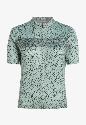 Trumpas rankovėmis, mėtų žalios spalvos marškinėliai su juodais taškeliais, vertikaliomis juostelėmis prie krūtinės, maža apykaklė ir visiškai užtrauktas priekinis užtrauktukas.