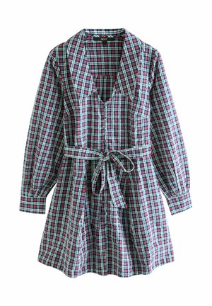 Plisseret kjole med lange ærmer, dyb udskæring og bindebånd i taljen. Har et mønster af røde, blå og grønne firkanter på letvægtsstof.