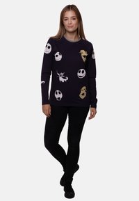 Navy long-sleeve sweatshirt featuring various graphic designs, including skulls and a ghost, with a crew neck and soft texture.