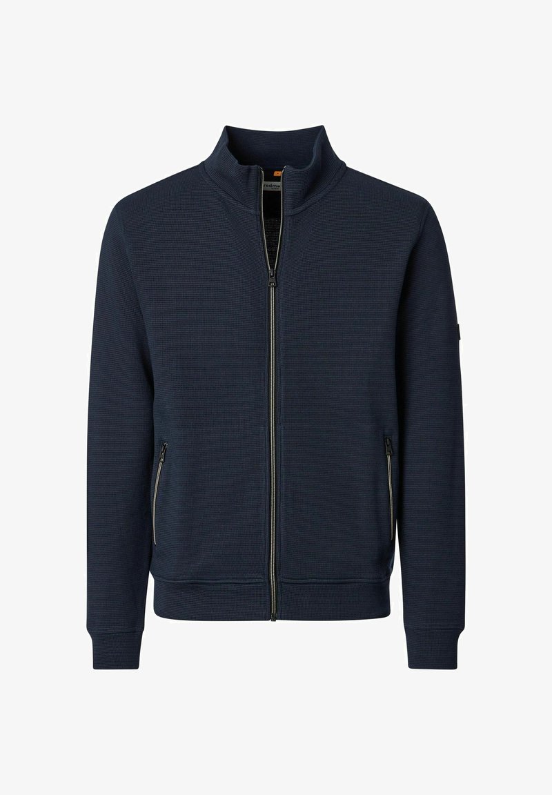 Marineblauw jack met rits en opstaande kraag, textuurstof, lange mouwen en ritssluitingen aan de zijkanten, weergegeven op een witte achtergrond.