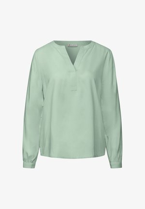 Hellgrüne Bluse mit langen Ärmeln aus einem glatten Stoff, mit V-Ausschnitt, lockerer Passform und gerafften Manschetten. Minimalistisches Design ohne Muster.