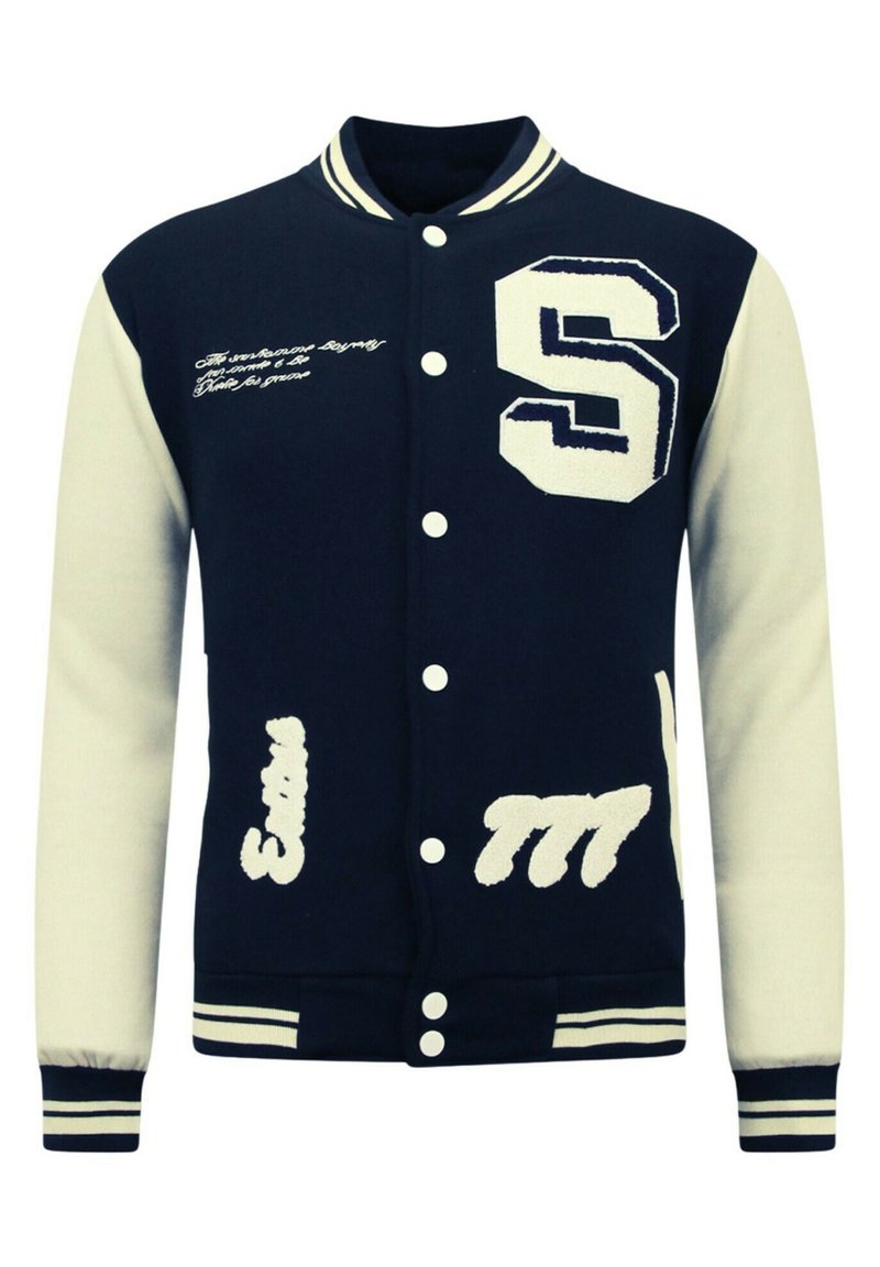 Marineblauwe varsityjack met crèmekleurige mouwen, voorzien van een geborduurde "S" en witte letters. Knopsluiting aan de voorkant en gestreepte ribgebreide boorden.