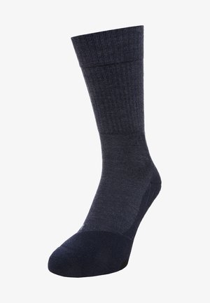 Donkerblauwe kniekous met ribbelstructuur, verstevigde teen en gladde bovenrand. Gemaakt van een comfortabele materialenmix.