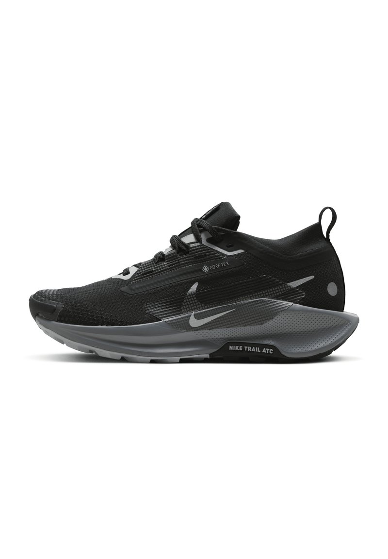Black and grey trail running shoes with a textured upper, reflective accents, and a cushioned sole featuring the "Nike Trail ATC" logo.