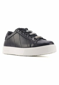 Black leather sneaker with a textured white rubber sole, featuring diagonal stitching, black laces, and sparkly silver-accented laces.