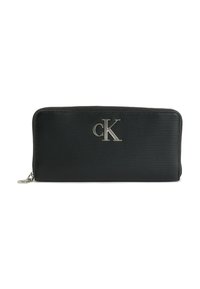 Portafoglio nero con zip realizzato in materiale testurizzato, con logo Calvin Klein argentato sul fronte. Forma rettangolare compatta.